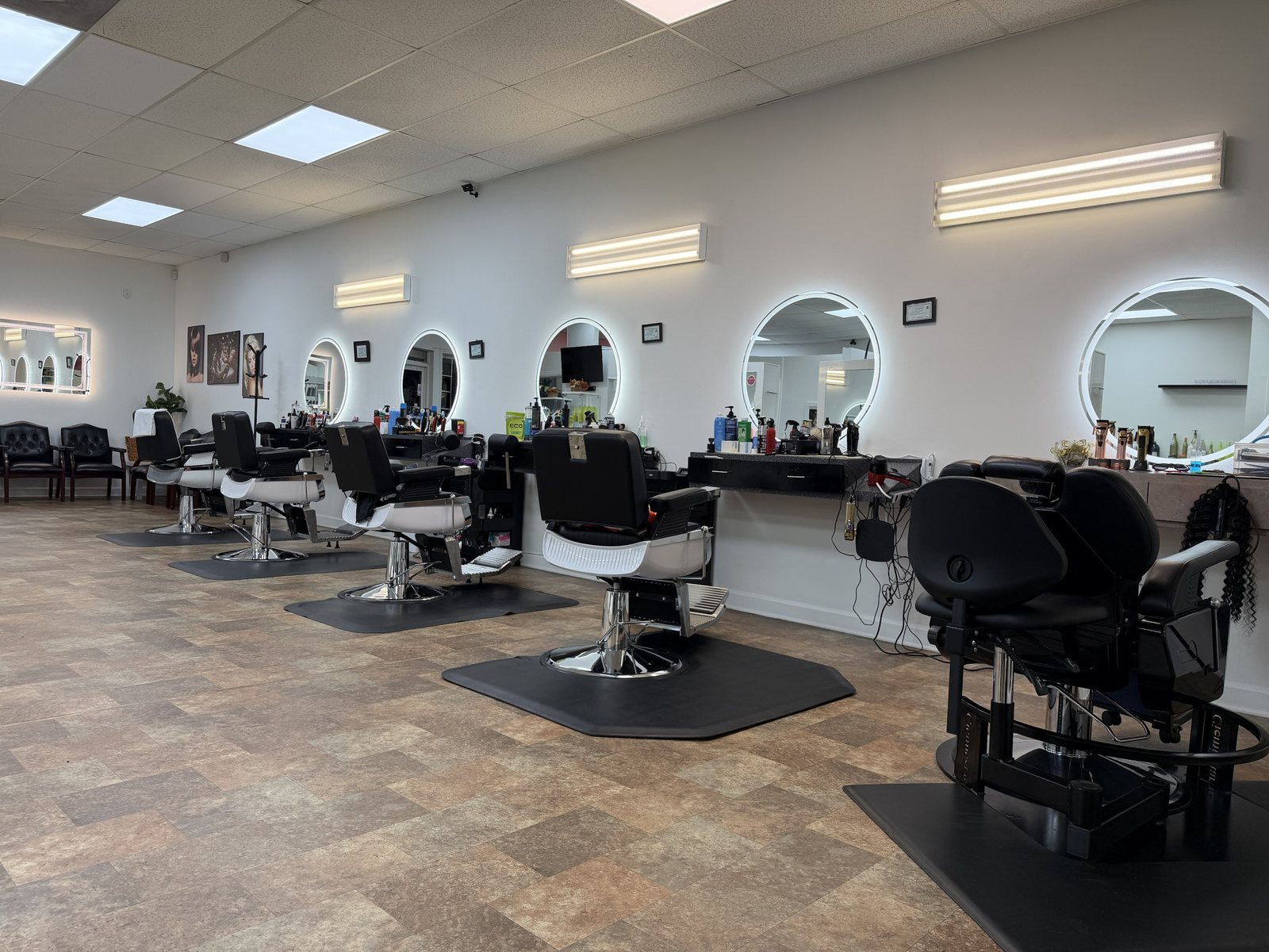Inside the Rafielys barbershop — chairs and stations